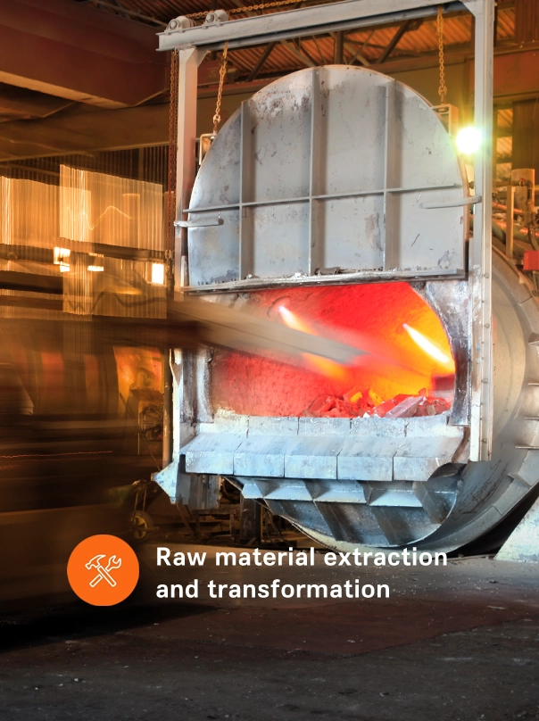 An open industrial furnace with glowing material inside, labelled “Raw material extraction and transformation".
